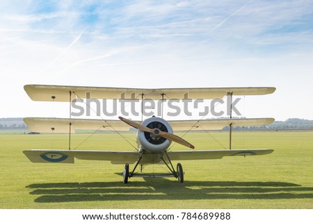 Front view of a triplane on the ground