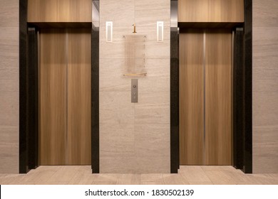 Front view of Two close elevators at old Hotel,  Interior  design vintage style with marble wall and wooden door, Image for background