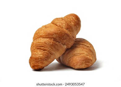 front view two fresh croissants pile isolated on white background. Close-up image
