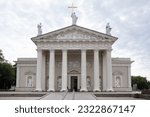 Front view of Vilnius Cathedral in Lithuania with pediment and on top a sculpture of Saint Helena with cross