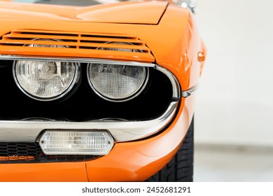 Front view of a vintage orange car. Headlights. Classic car. - Powered by Shutterstock