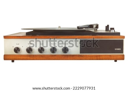Front view of a vintage turntable with knobs isolated on a white background