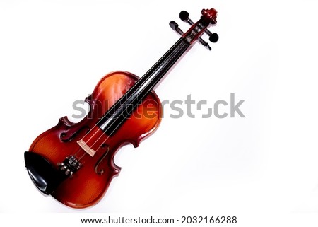 Front view of violin with fiddlesticks isolated on white background