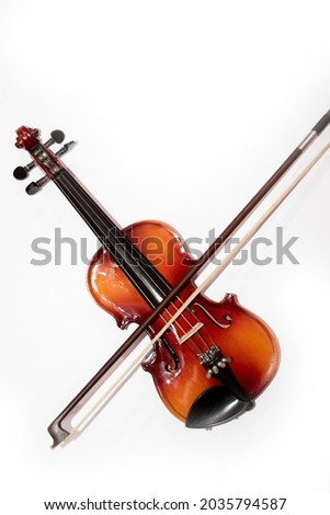 Front view of violin with fiddlesticks isolated on white background