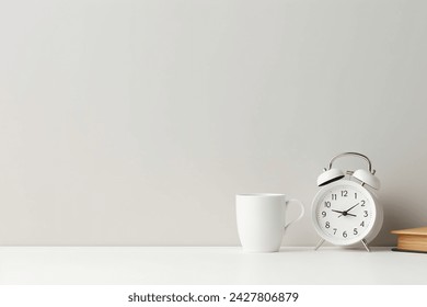 Front view white desk with alarm clock coffee paper cup copy space morning background banner with free space for text minimalistic concept workspace time to work blank workplace office mockup