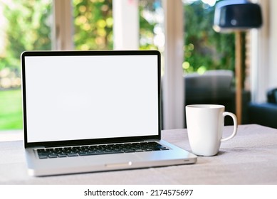 Front View Of White Screen Laptop In The Living Room Near To The Garden.
Remote Work. Freelance. Work From Home. Telework. Copy Space