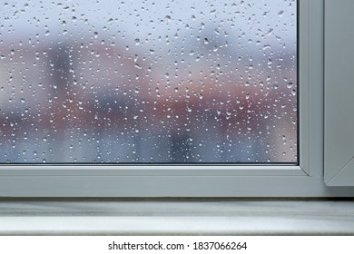 Front View Window Sill On Falling Rain Drops