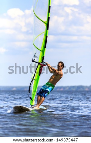 Front view of a windsurfer passing by