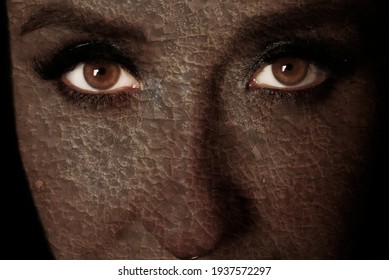 Front View Of Womans Face. Close Up Image. Dark Cracked Skin. Female Looking At Camera