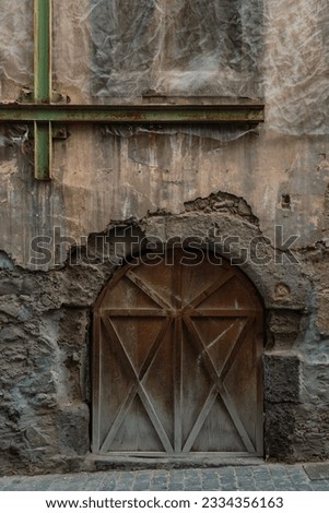 Front view of wooden door in abandoned building in old town in the city of Las Palmas de Gran Canaria, Spain