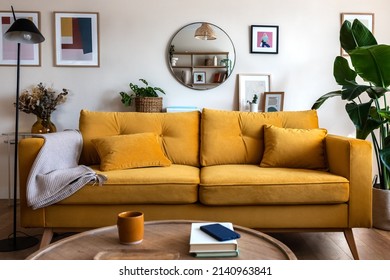 Front View Of Yellow Couch In Living Room Apartment Interior.