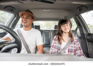 Front view young asian couple happiness and smiling sitting in car. Travel concept, Safety first insurance concept - Powered by Shutterstock
