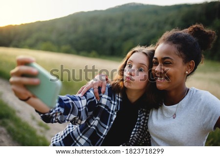 Similar – Image, Stock Photo two beautiful teenager girls floating in a pool