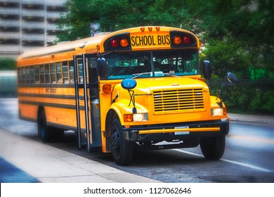 Front Viiew Of A Schoolbus Parked In The Streets. Selective Focus.