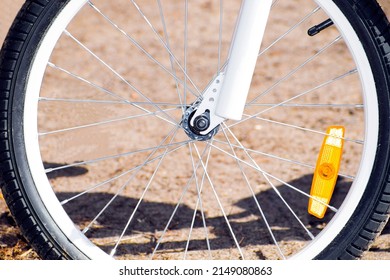 the front wheel of a bicycle with a hearse. front fork. close-up