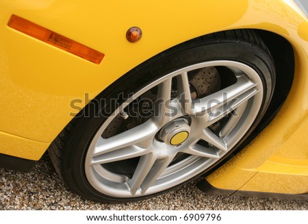 Front wheel of a bright yellow super car