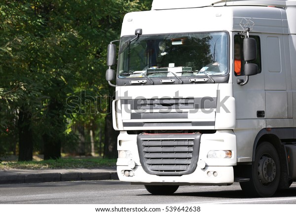 Front of white American\
cargo truck