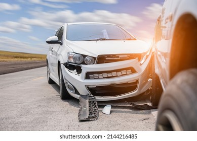 Front of white car get damaged by accident on the road, Car crash accident on street.  - Shutterstock ID 2144216485