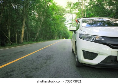 Front Of White Car Parking On Asphalt Road