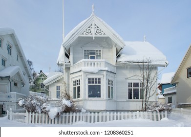 Front Of A White Wooden House Covered In Snow In Tromso, Norway