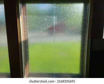 A Front Window That Is Made Of Glass That Doesn't Allow For Clear Sight Through It.