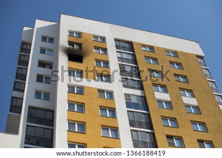 Front and windows of a condominium after an explosion and fire in its apartment.