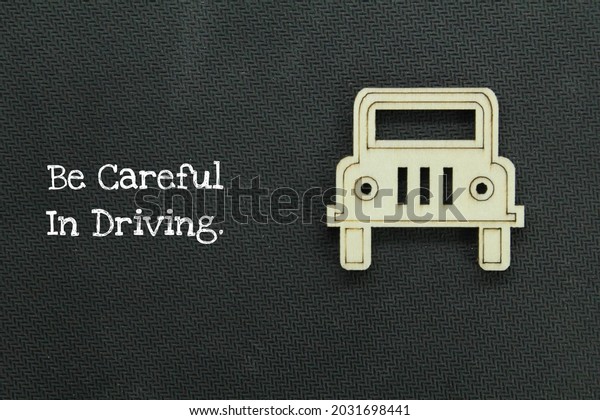 the front of a wooden car with the words be\
careful in driving