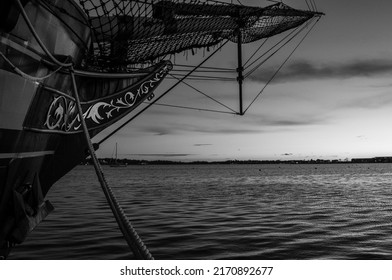 Front Of Wooden Ship With Sunset Background. Ship Bow With Ocean Sunset. Pirate Ship Exterior Docked On Boat Dock. Abstract Nature. Minimal Industrial Design. 