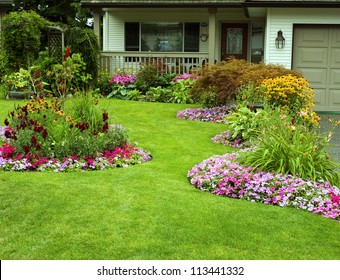 Front Yard Landscaping.  A beautifully manicured front yard with a garden full of perennials and annuals.