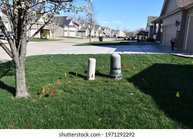 A Front Yard With Utility Flags All Over It. The Neighborhood Is In St. Peters, Missouri. Picture Taken On March 27th, 2021.