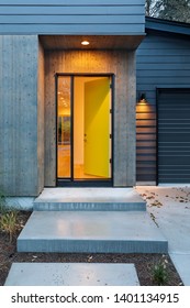 Front Yellow Door That Is Opened And Illuminated