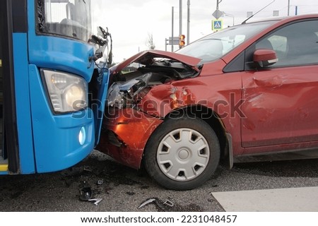 Frontal collision of a car and a bus.  Head-on collision between bus and car. Car accident. Traffic accident.                               