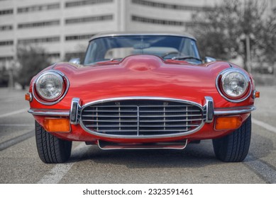 Frontal photo of a classic British red car  - Shutterstock ID 2323591461