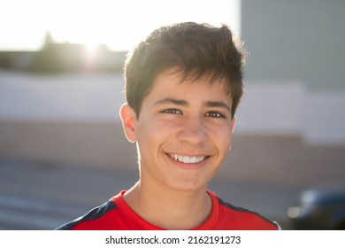 Frontal portrait of a smiling adolescent - Shutterstock ID 2162191273