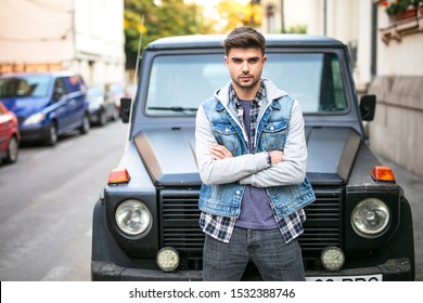 Frontal Pose With A Cool Young Man Standig In Front Of His Cool Muscle Black Car Looking Confident