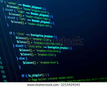 The frontend developer is doing javascript coding. Abstract code background. Selective focus code on computer screen