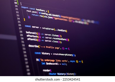 The frontend developer is doing javascript test coding. Abstract code background. Selective focus code on computer screen