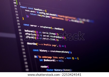 The frontend developer is doing javascript test coding. Abstract code background. Selective focus code on computer screen