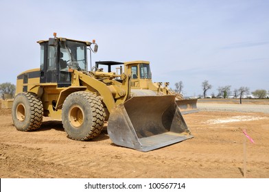 Frontend Loader, A Construction Equipment At A Construction Site