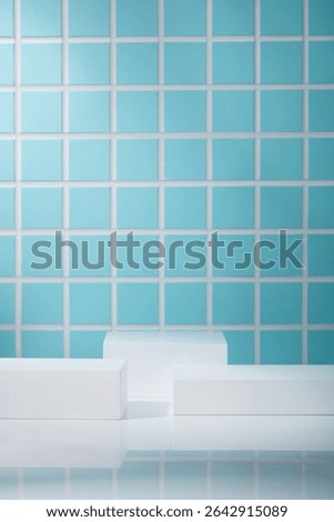 Front-facing composition with stacked white rectangular podiums. Glossy surface and turquoise tile wall offer a fresh and clean aesthetic.
