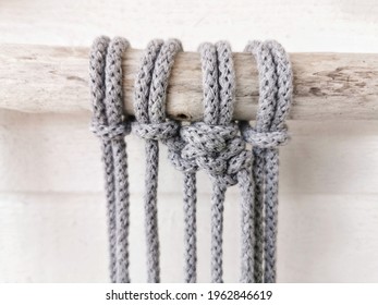 A Front-view Of Crochet Grey Cotton Yarn Wall Hanging In The Making Process