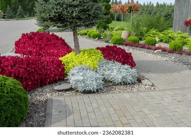 Frontyard with Paver Walkway. Beautiful Garden path made of natural stones, gravel. Huge landscaping trend. Lawn, shrubbery in the backyard. Scenic of nice landscaped. Home design. Garage driveway - Shutterstock ID 2362082381