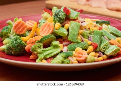 Frosen vegetables with ice. Frozen vegetables assorted