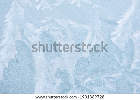 frost froze the window and painted patterns on it, snow background