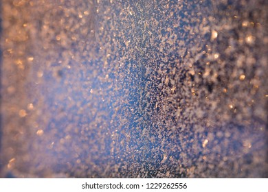 Frost on the window. Image with selective focus and toning.

