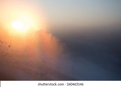 Frost On The Window With Morning Sun In Backlight