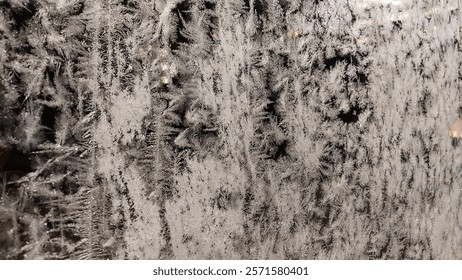 Frost pattern on the glass surface. Nature crystalic ice ornament. Cold night. Close view. Winter