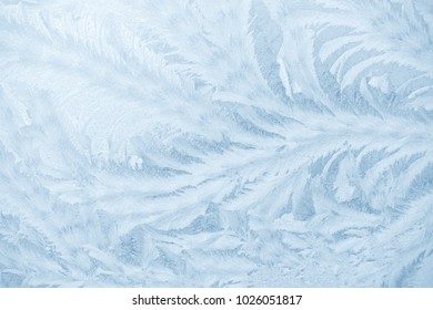 Frost patterns on window glass in winter. Frosted Glass Texture. Blue - Shutterstock ID 1026051817