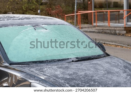 Frosted Car Windshield on a Cold Morning - Ice Covered Vehicle Glass Winter Weather