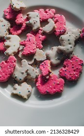 Frosted Circus Animal Cookie Pink And White Sprinkled Animal Crackers On White And Gold Plate